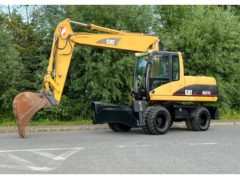 Excavadora de ruedas Caterpillar CAT M315C  CATERPILLAR SPROWADZONY  Bardzo Dobry Stan: foto 2 Excavadora de ruedas Caterpillar CAT M315C  CATERPILLAR SPROWADZONY  Bardzo Dobry Stan: foto 2