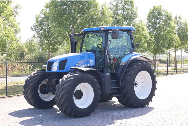 New Holland TS135A | 40 KM/H | 4X4 | SUPERSTEER - Tractor: foto 1 New Holland TS135A | 40 KM/H | 4X4 | SUPERSTEER - Tractor: foto 1
