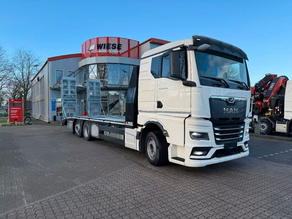 MAN Baumaschinen- Arbeitsbühnentransporter Rampen - Camión caja abierta: foto 1 MAN Baumaschinen- Arbeitsbühnentransporter Rampen - Camión caja abierta: foto 1