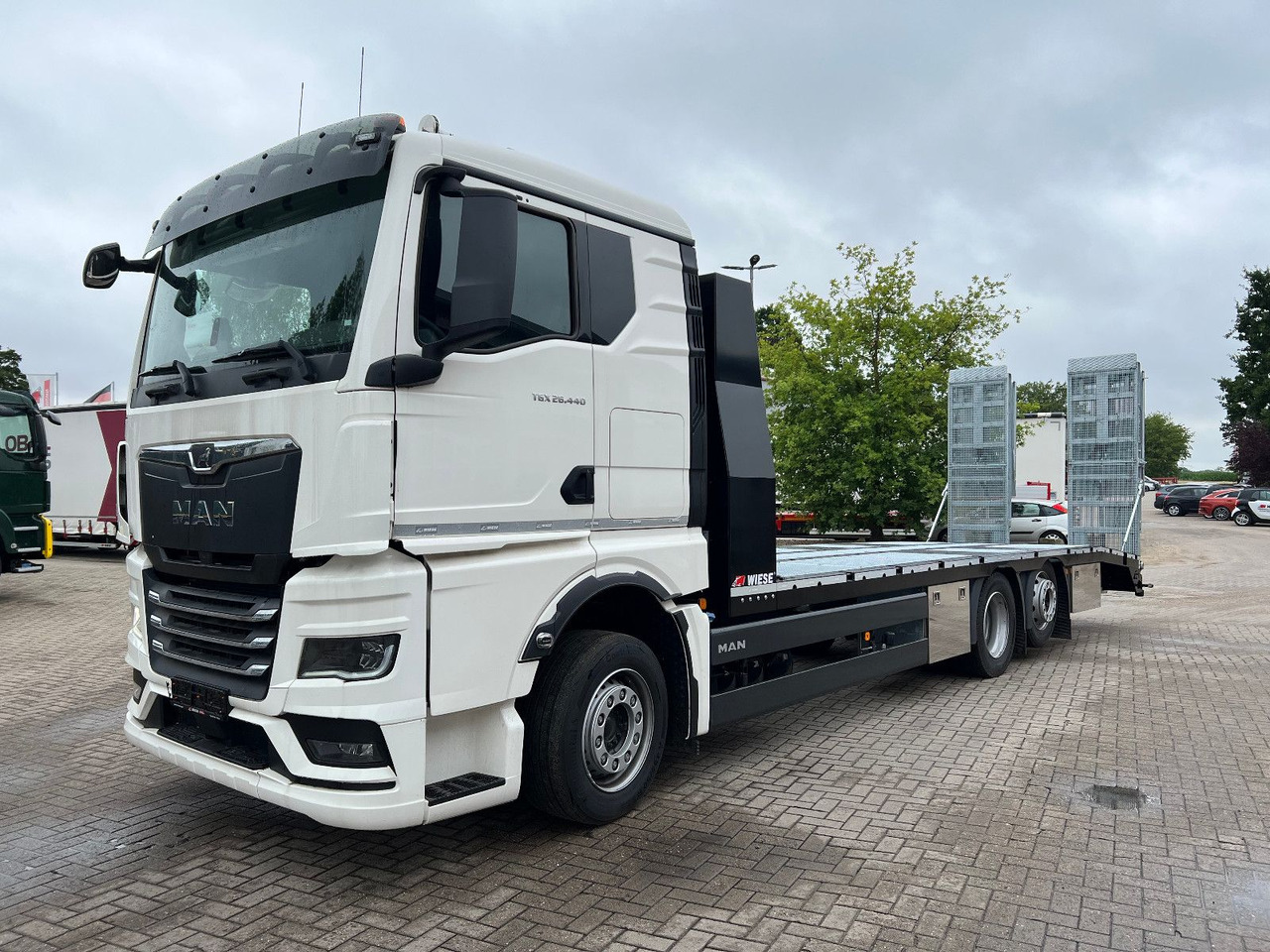 MAN Baumaschinen-  Arbeitsbühnentransporter Rampen - Grua de remolque autos: foto 3 MAN Baumaschinen-  Arbeitsbühnentransporter Rampen - Grua de remolque autos: foto 3