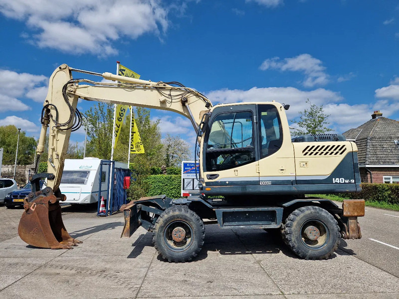 Hyundai Robex 140W-9 met airco - Excavadora de ruedas: foto 1 Hyundai Robex 140W-9 met airco - Excavadora de ruedas: foto 1
