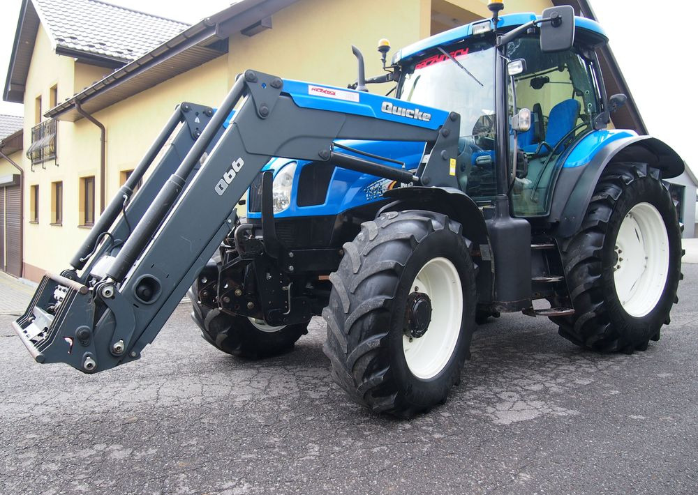 Ciągnik New Holland NH TS125A 6 cylindrów 2004 Ciągnik rolniczy New Holland TS125A - Tractor: foto 1 Ciągnik New Holland NH TS125A 6 cylindrów 2004 Ciągnik rolniczy New Holland TS125A - Tractor: foto 1