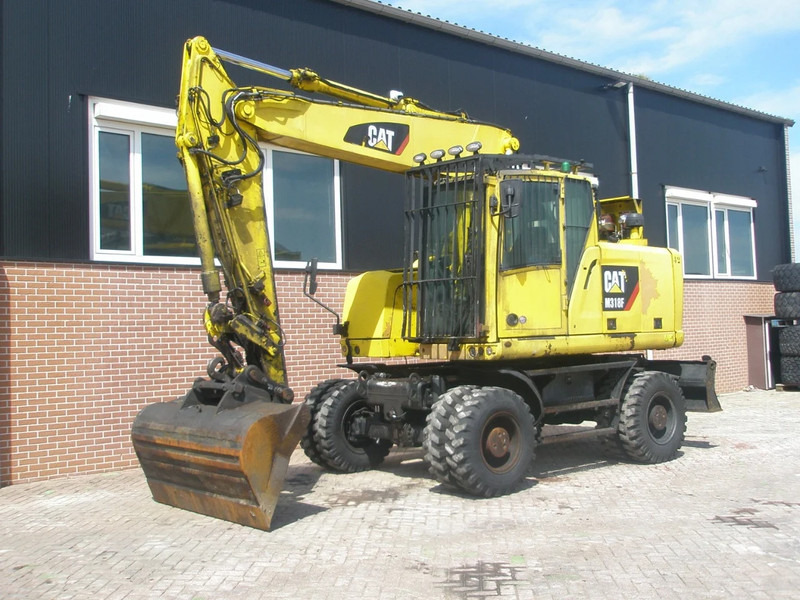 Caterpillar M318F - Excavadora de ruedas: foto 1 Caterpillar M318F - Excavadora de ruedas: foto 1