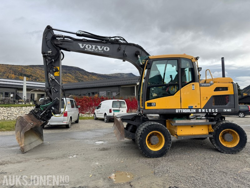 2012 Volvo EW140 D Hjulmaskin TILTROTATOR, 2 SKUFFER, SENTRALSMØRING - Excavadora: foto 1 2012 Volvo EW140 D Hjulmaskin TILTROTATOR, 2 SKUFFER, SENTRALSMØRING - Excavadora: foto 1