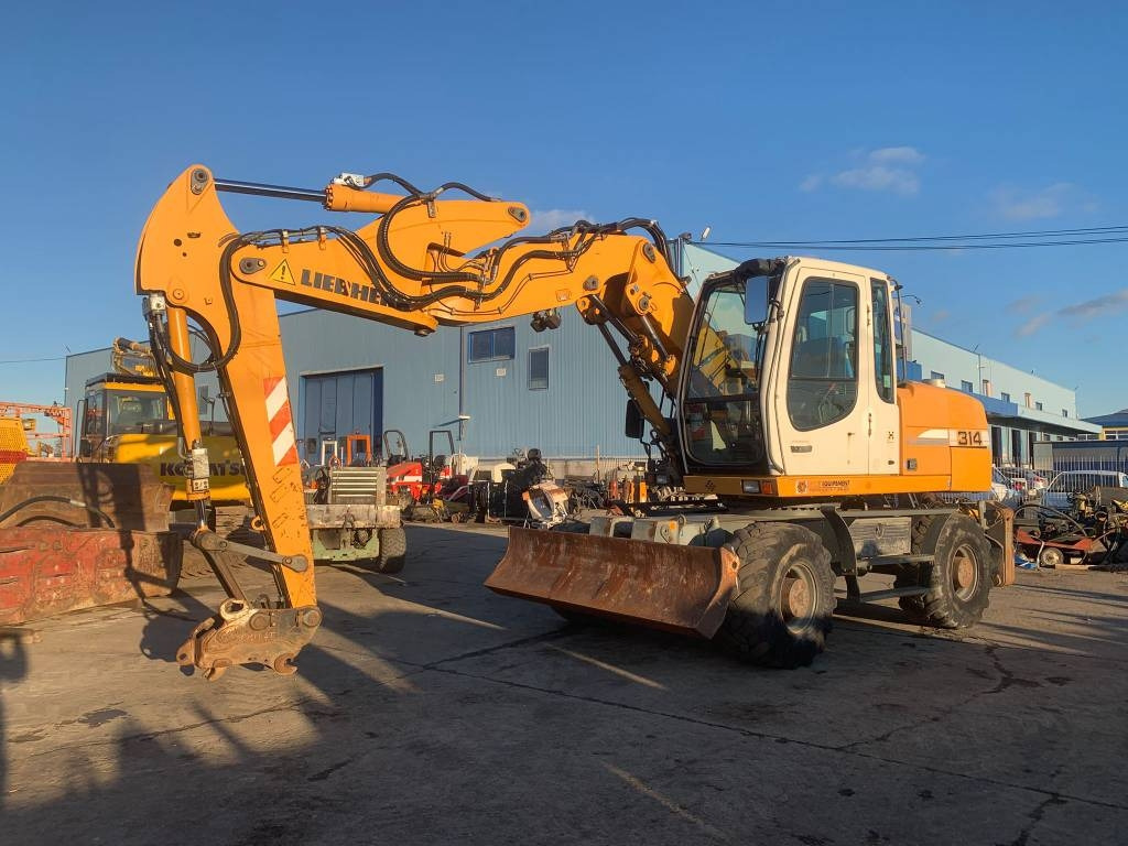 Liebherr A 314 Litronic - Excavadora de ruedas: foto 1 Liebherr A 314 Litronic - Excavadora de ruedas: foto 1