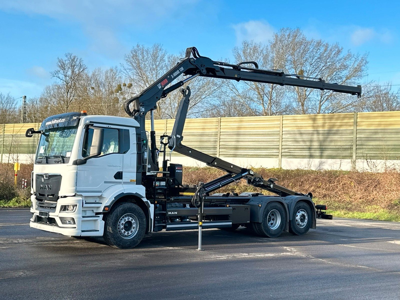 MAN TGS 26.470 6x2 Abrollkipper + Kran Hiab 138-3 - Camión multibasculante, Camión grúa: foto 1 MAN TGS 26.470 6x2 Abrollkipper + Kran Hiab 138-3 - Camión multibasculante, Camión grúa: foto 1