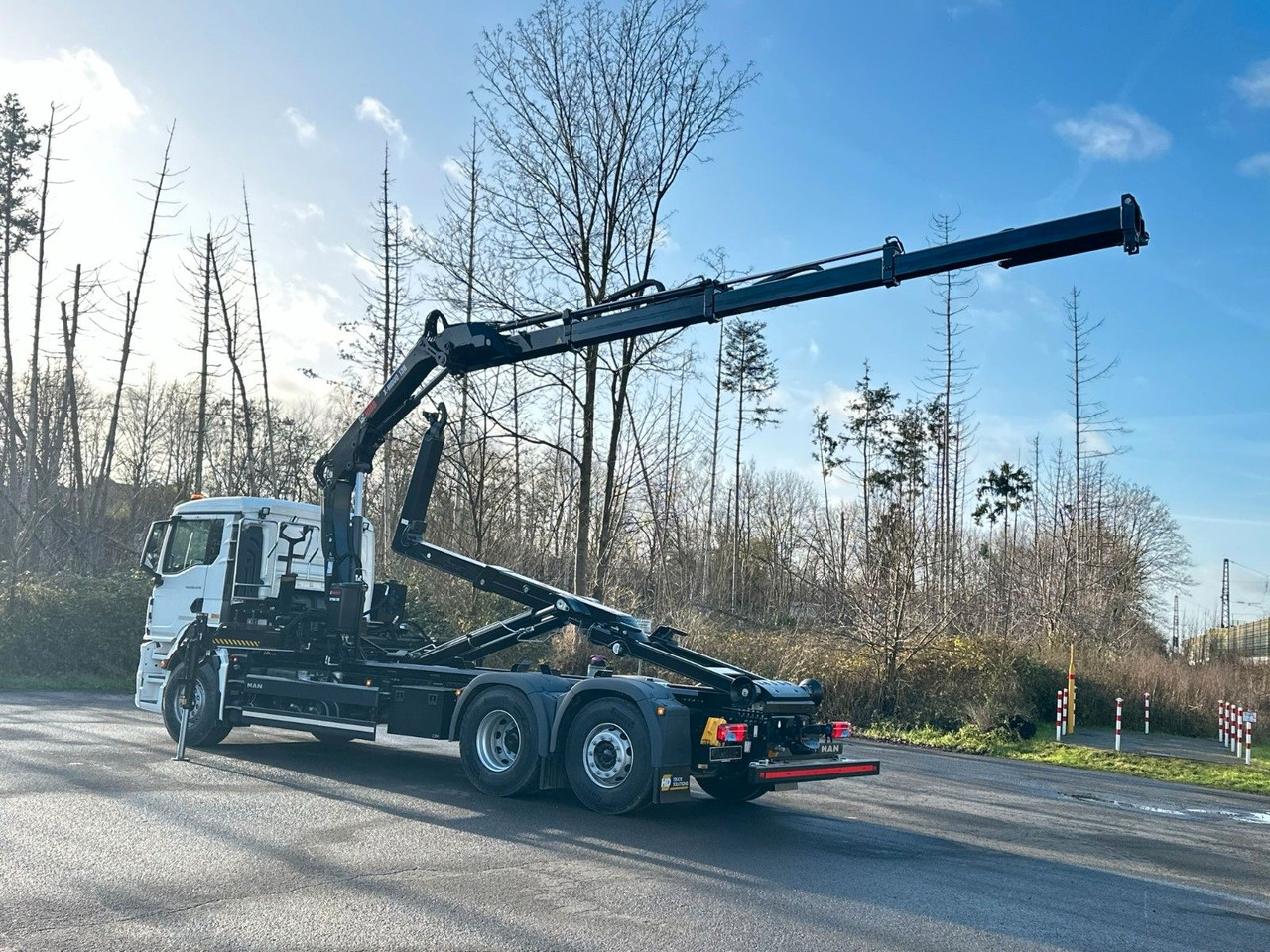 MAN TGS 26.470 6x2 Abrollkipper + Kran Hiab 138-3 - Camión multibasculante, Camión grúa: foto 4 MAN TGS 26.470 6x2 Abrollkipper + Kran Hiab 138-3 - Camión multibasculante, Camión grúa: foto 4