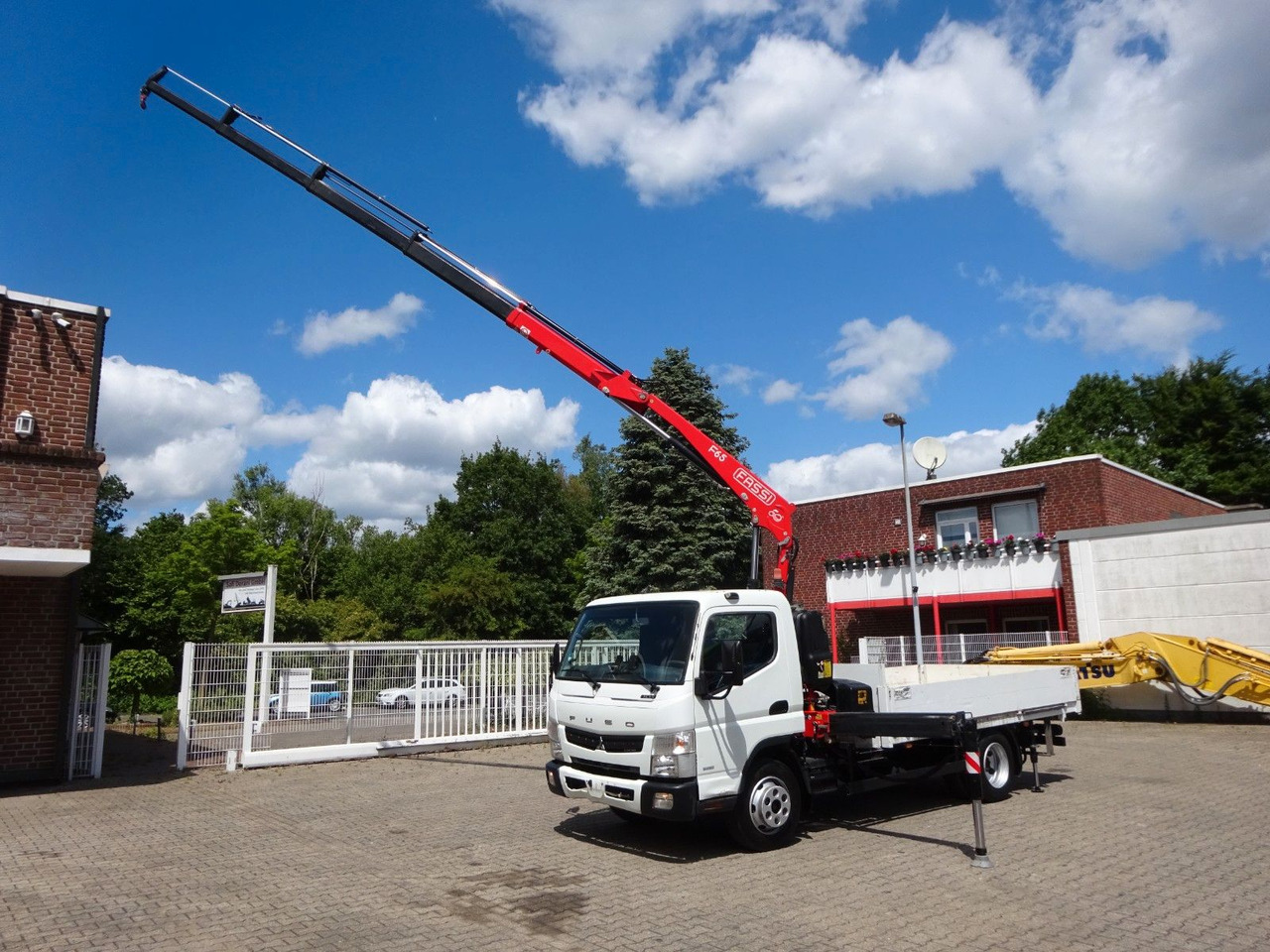 FUSO Canter 7C15 mit FASSI F65A Kran - Furgoneta caja abierta: foto 1 FUSO Canter 7C15 mit FASSI F65A Kran - Furgoneta caja abierta: foto 1