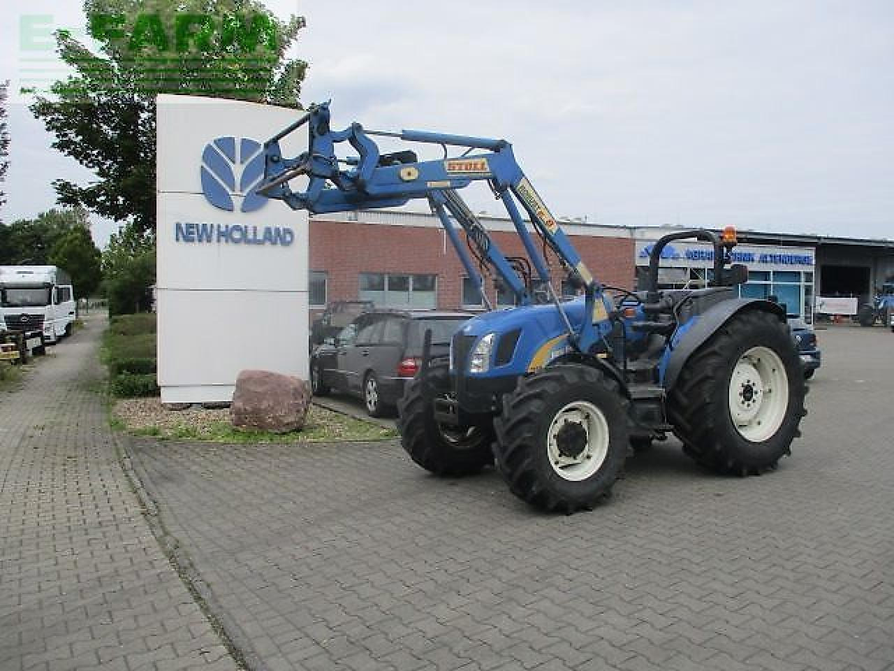 New Holland tn70 a niedrige bauhöhe - Tractor: foto 1 New Holland tn70 a niedrige bauhöhe - Tractor: foto 1